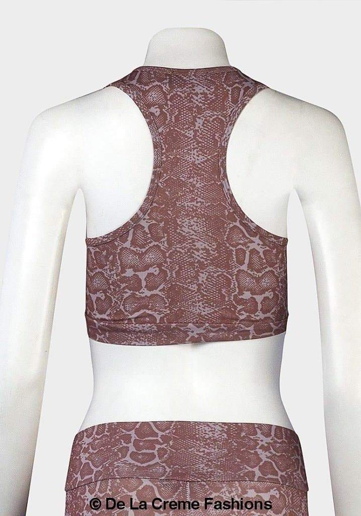 De La Creme Ladies Animal Print Crop Top featuring a scoop neckline, zip-through fastening, and sleeveless design in pale brown.