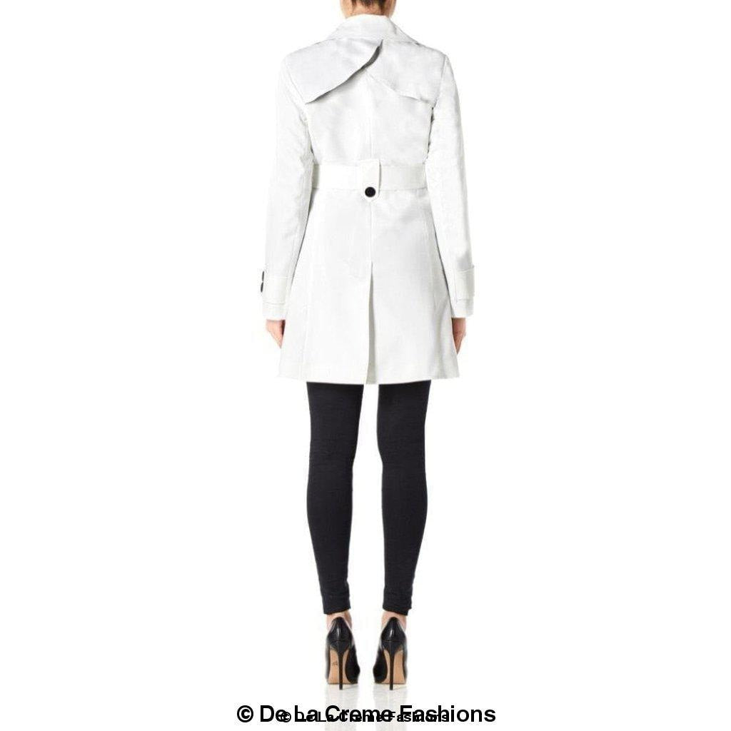 De La Creme Women's Mid Length Belted Mac Coat in black, featuring double-breasted fastening and a stylish belt.