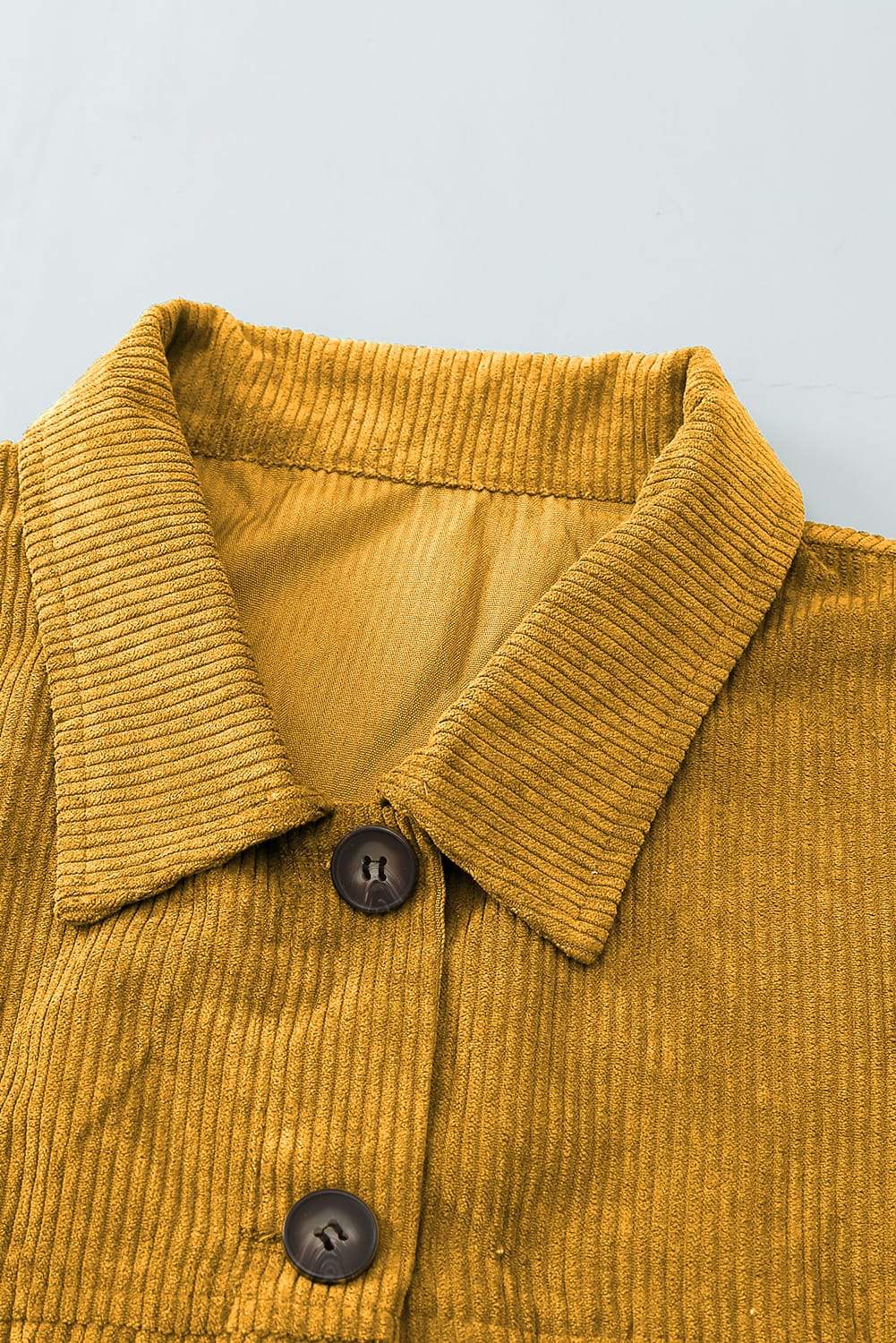 A stylish Fall Corduroy Shirt Coat in vibrant colors, featuring a turn-down collar and button-up design, perfect for autumn and winter wear.