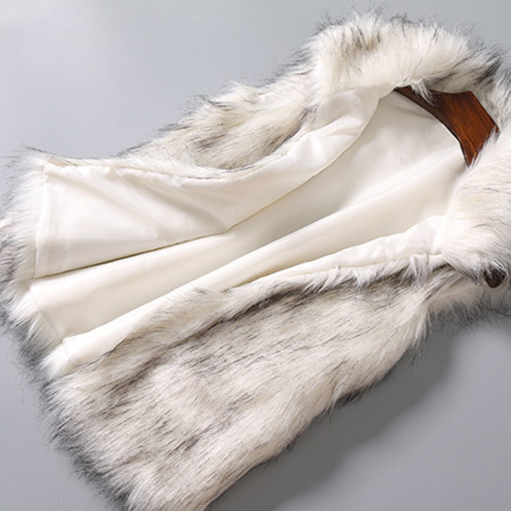 A luxurious faux fur vest with a standing collar, showcasing a natural color and sleeveless design, perfect for stylish layering.