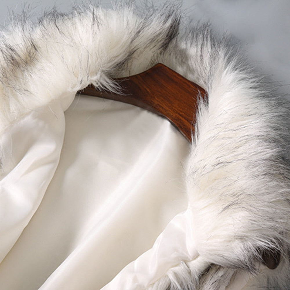 A luxurious faux fur vest with a standing collar, showcasing a natural color and sleeveless design, perfect for stylish layering.