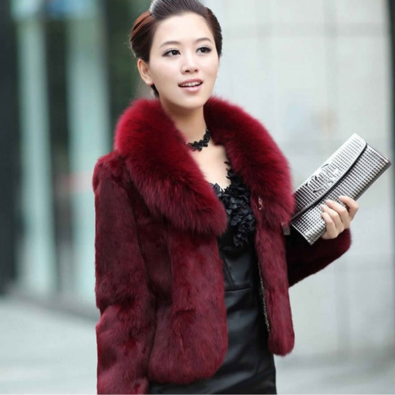 High Quality Winter Warm Fluffy Faux Fur Coat for Women featuring a faux fox fur collar, perfect for winter fashion.