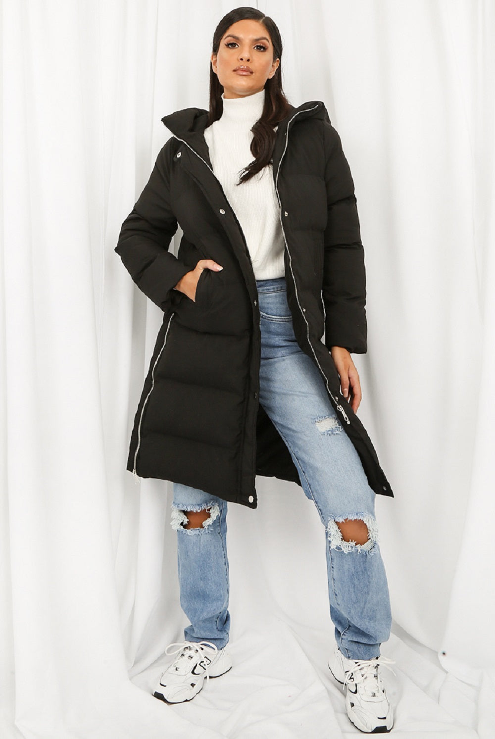 A stylish Hooded Longline Puffer Coat in black, featuring a zip closure and side pockets, perfect for winter wear.