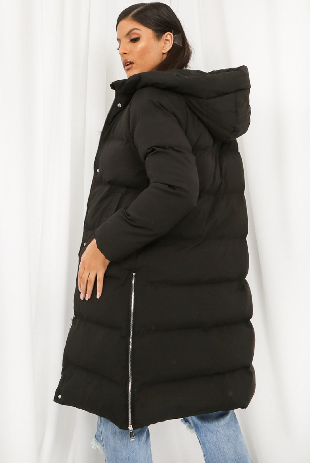 A stylish Hooded Longline Puffer Coat in black, featuring a zip closure and side pockets, perfect for winter wear.