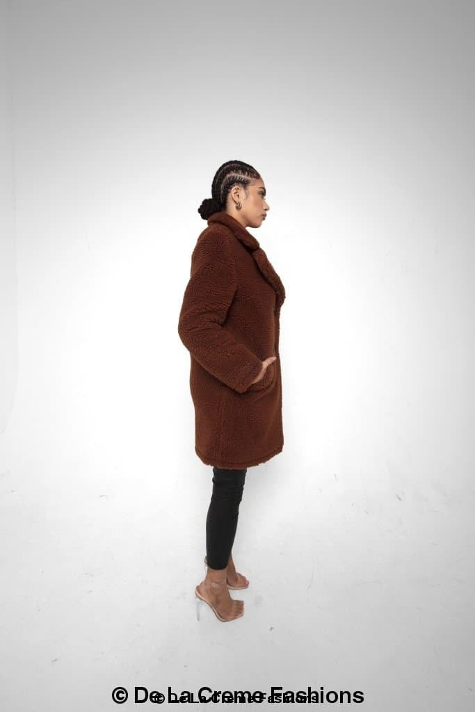 Janine Double Breasted Borg Teddy Coat in a stylish oversized design with a plush teddy finish, featuring double-breasted buttons and side pockets.