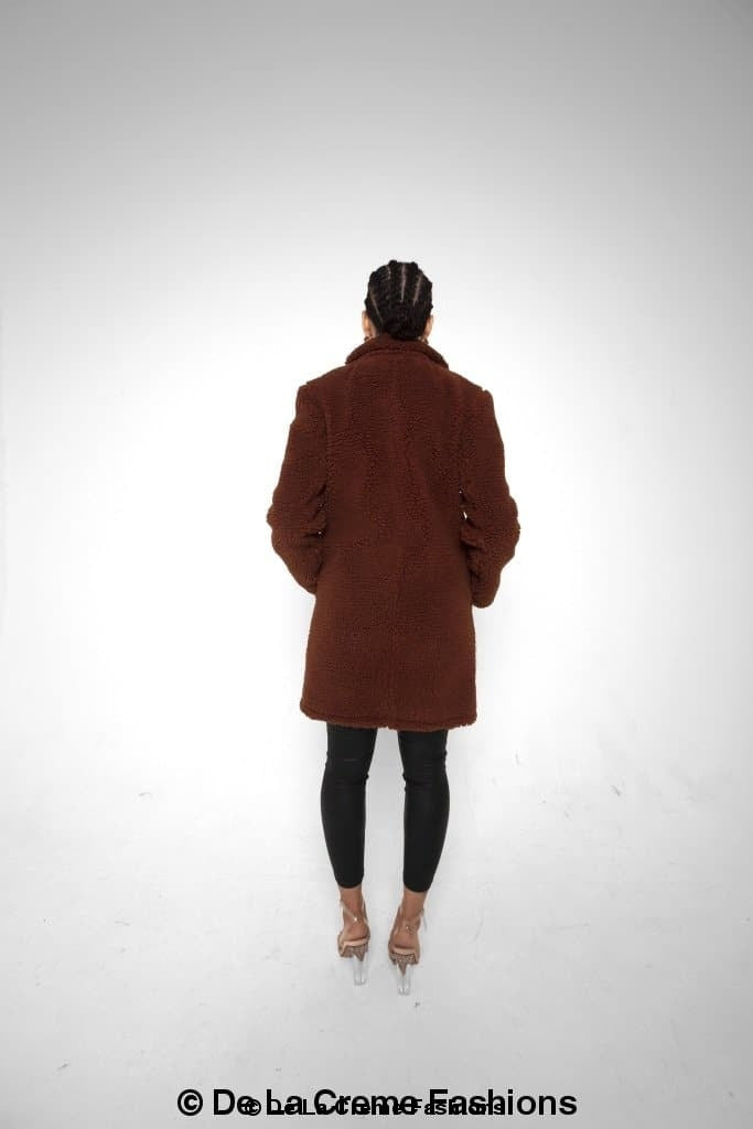 Janine Double Breasted Borg Teddy Coat in a stylish oversized design with a plush teddy finish, featuring double-breasted buttons and side pockets.