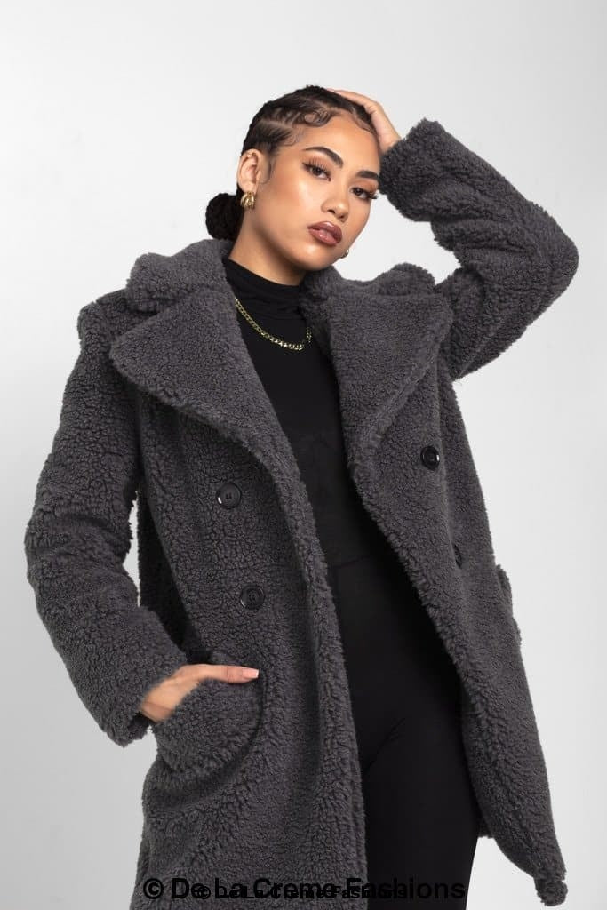 Janine Double Breasted Borg Teddy Coat in a stylish oversized design with a plush teddy finish, featuring double-breasted buttons and side pockets.