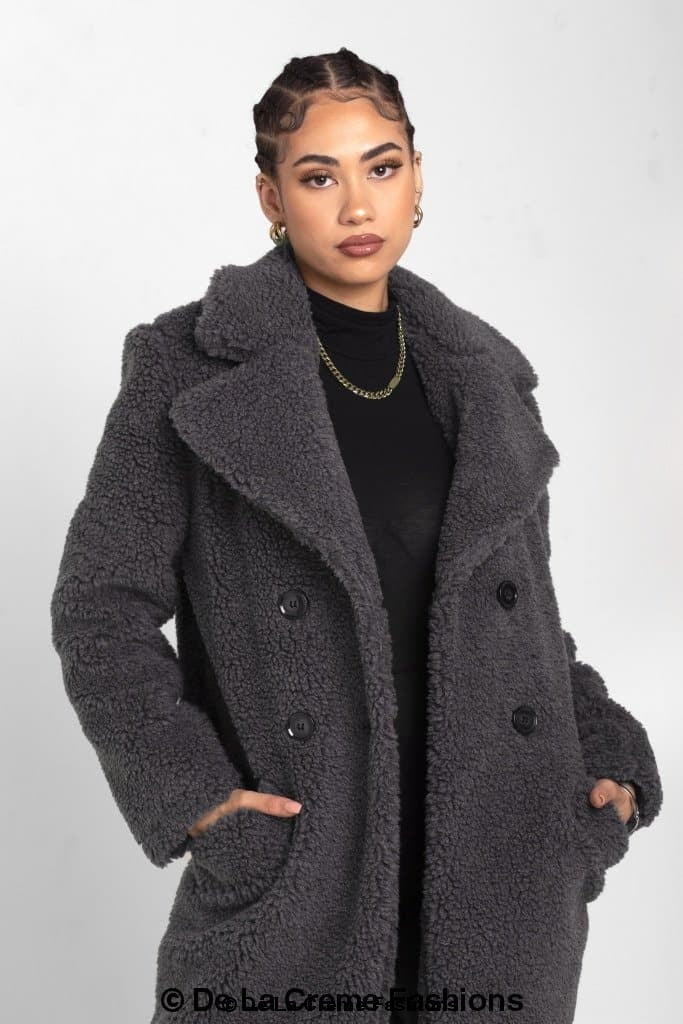 Janine Double Breasted Borg Teddy Coat in a stylish oversized design with a plush teddy finish, featuring double-breasted buttons and side pockets.