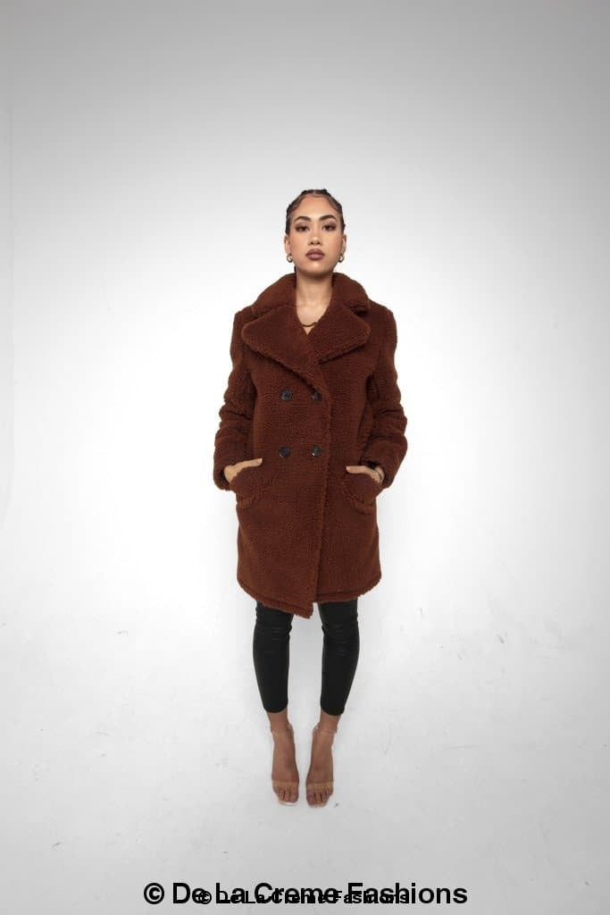 Janine Double Breasted Borg Teddy Coat in a stylish oversized design with a plush teddy finish, featuring double-breasted buttons and side pockets.