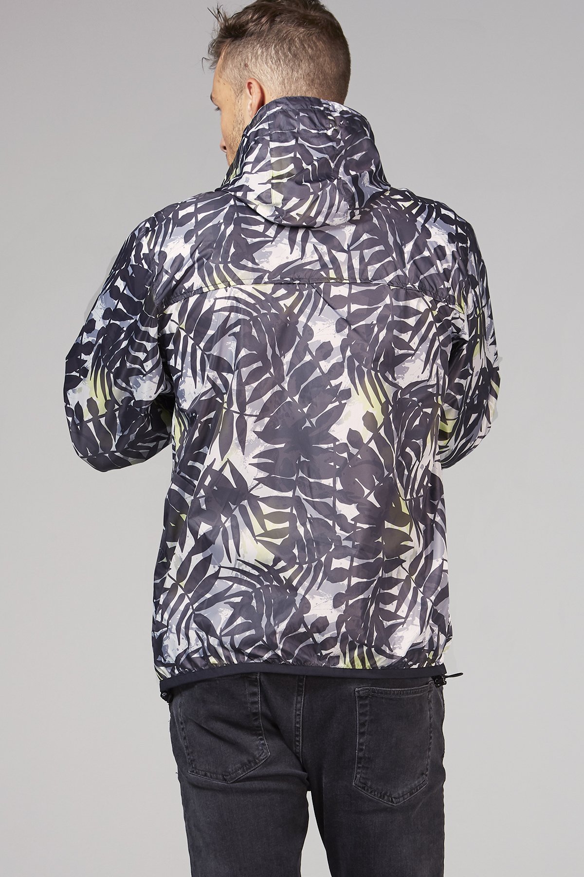 Men's palm print full zip packable rain jacket, showcasing its stylish design and practical features.