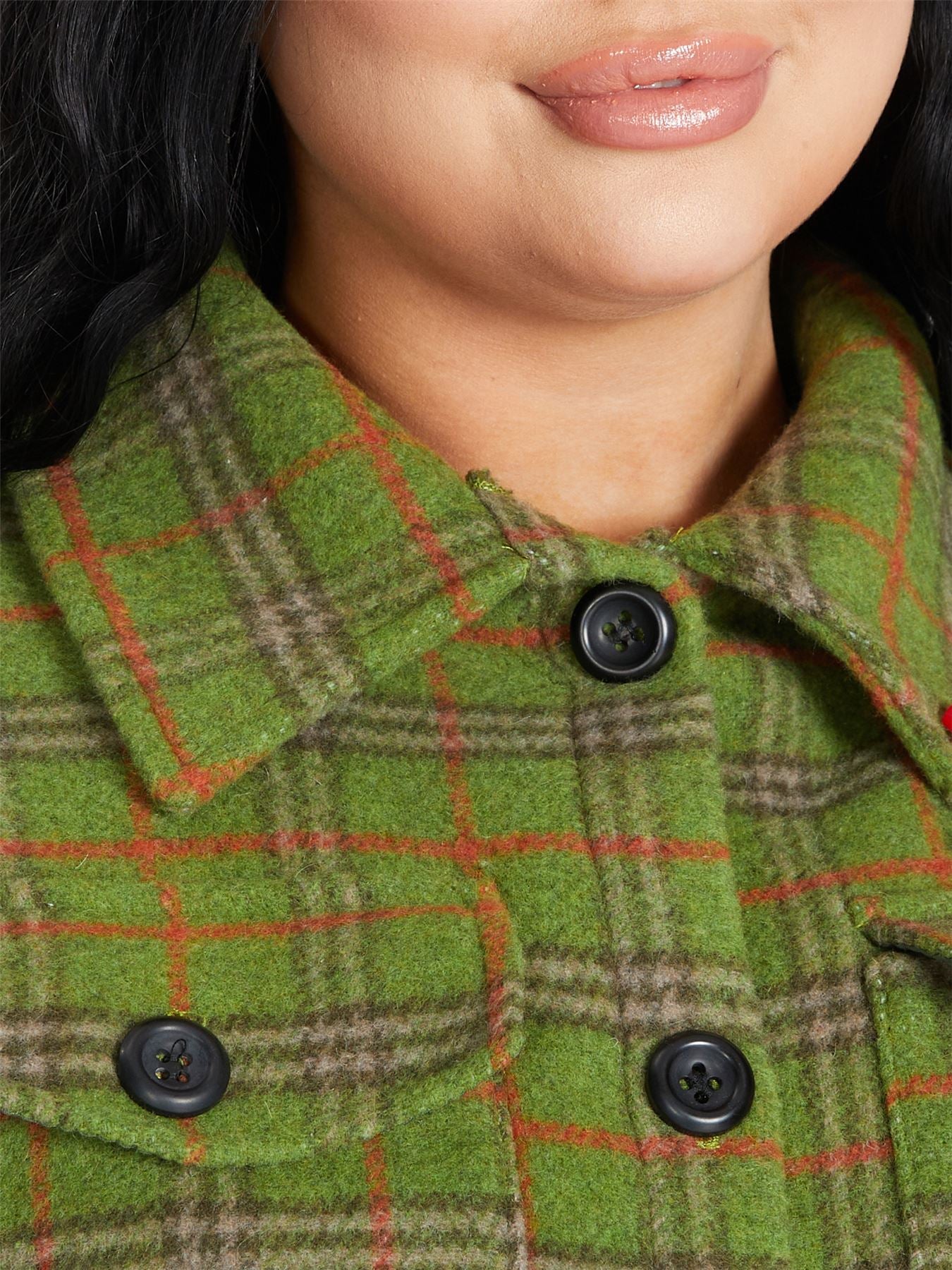 An oversized wool blend shacket featuring a luxurious nova check pattern, button down fastening, and a stylish design suitable for various occasions.