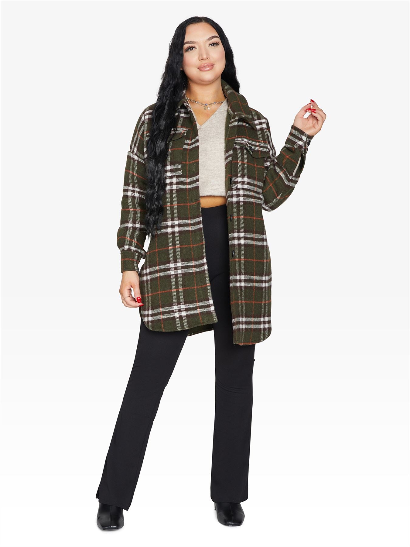 An oversized wool blend shacket featuring a luxurious nova check pattern, button down fastening, and a stylish design suitable for various occasions.