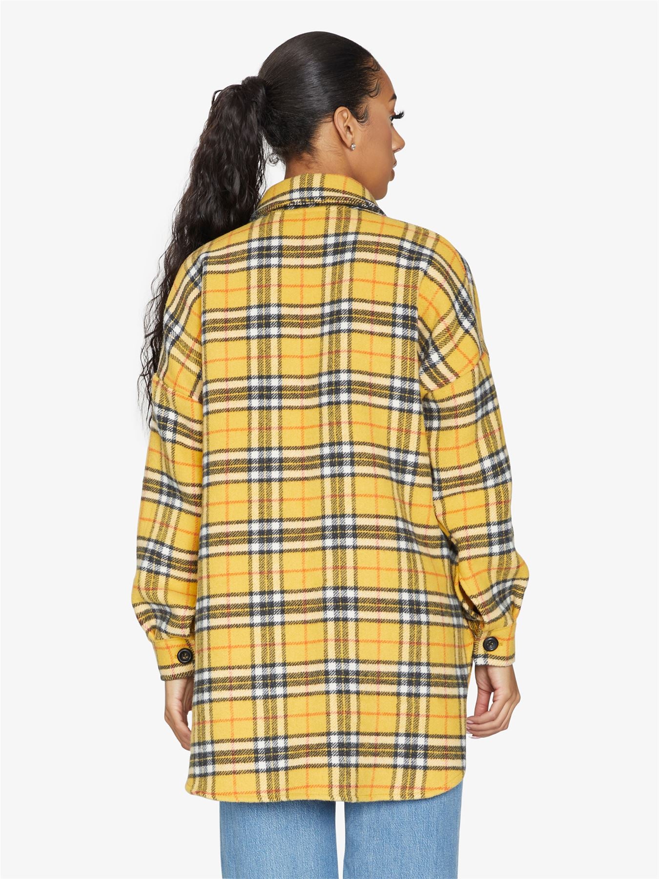 An oversized wool blend shacket featuring a luxurious nova check pattern, button down fastening, and a stylish design suitable for various occasions.