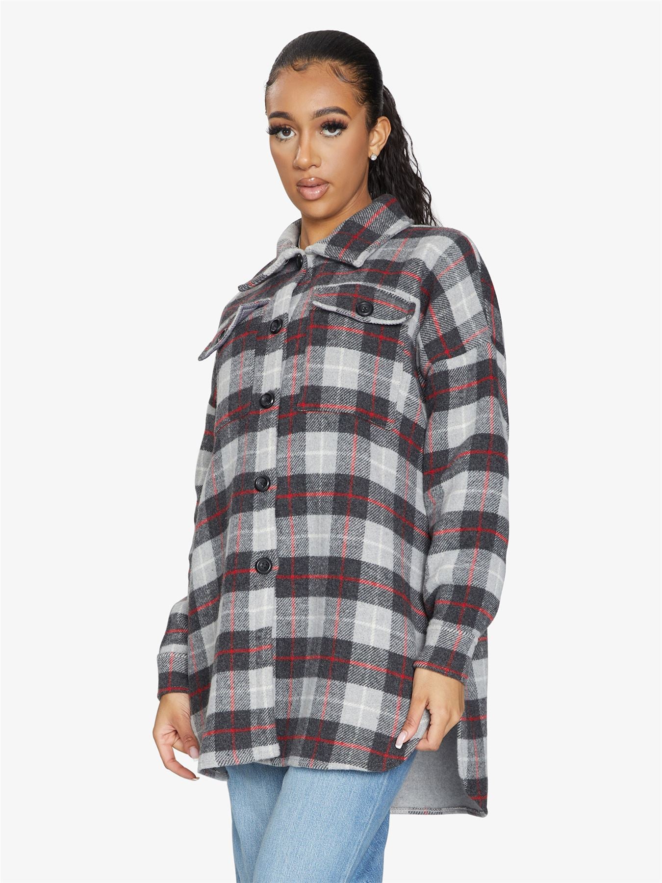 An oversized wool blend shacket featuring a luxurious nova check pattern, button down fastening, and a stylish design suitable for various occasions.