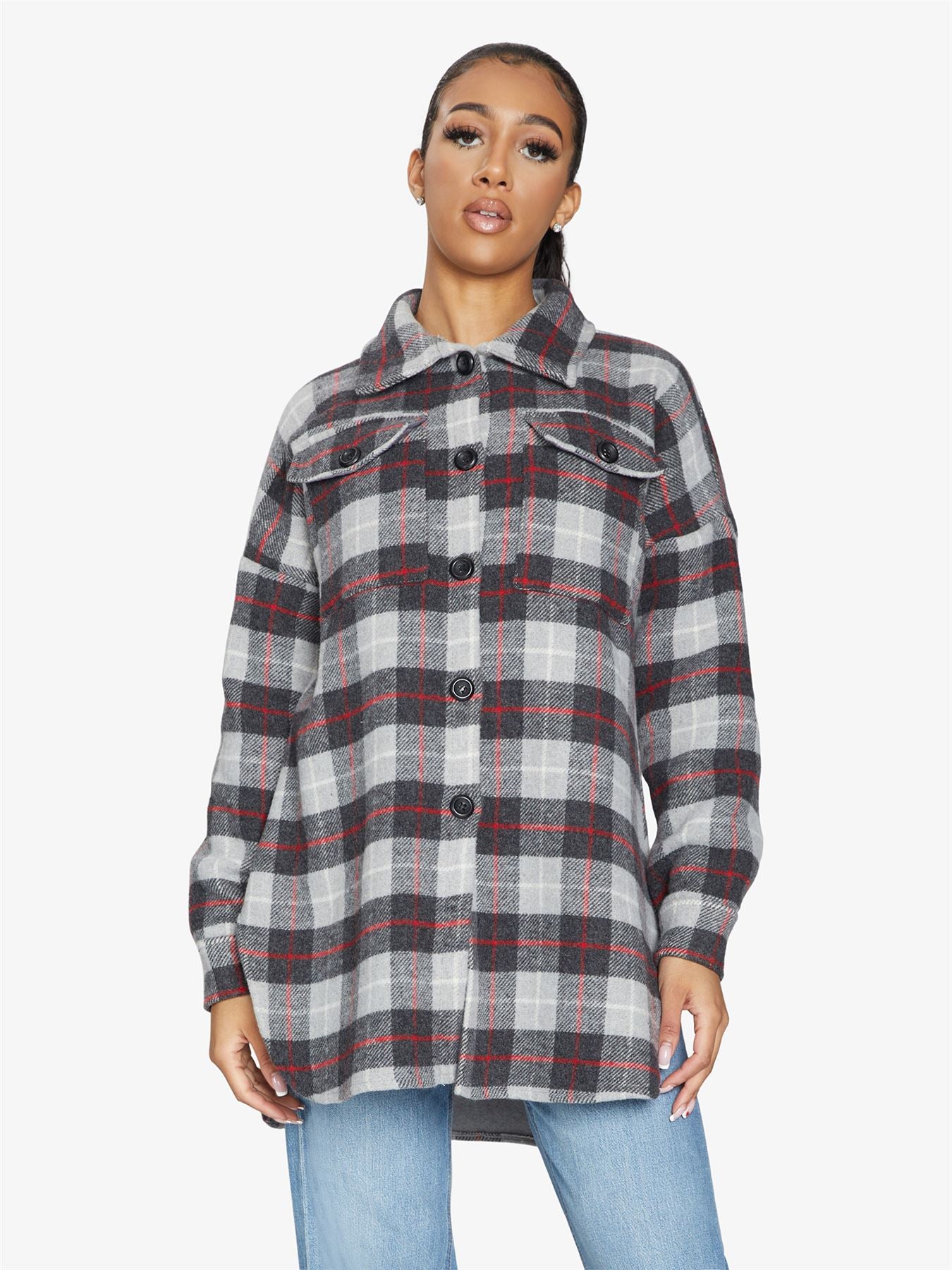 An oversized wool blend shacket featuring a luxurious nova check pattern, button down fastening, and a stylish design suitable for various occasions.