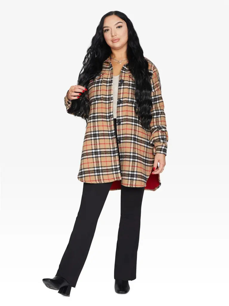 An oversized wool blend shacket featuring a luxurious nova check pattern, button down fastening, and a stylish design suitable for various occasions.