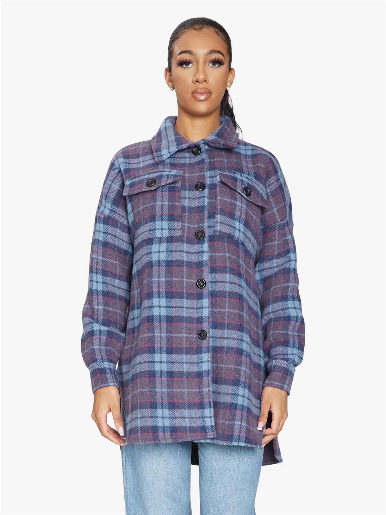 An oversized wool blend shacket featuring a luxurious nova check pattern, button down fastening, and a stylish design suitable for various occasions.