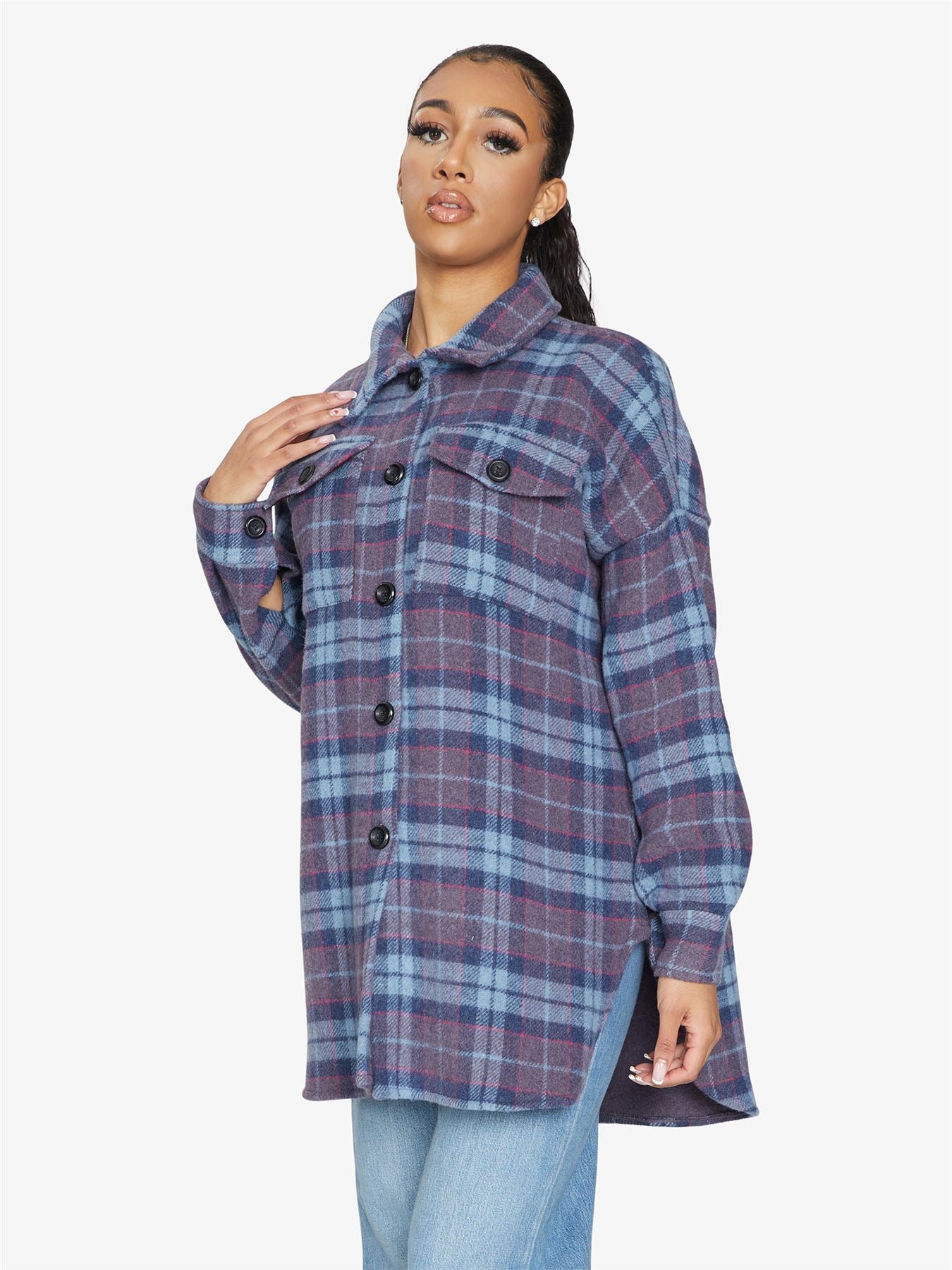 An oversized wool blend shacket featuring a luxurious nova check pattern, button down fastening, and a stylish design suitable for various occasions.