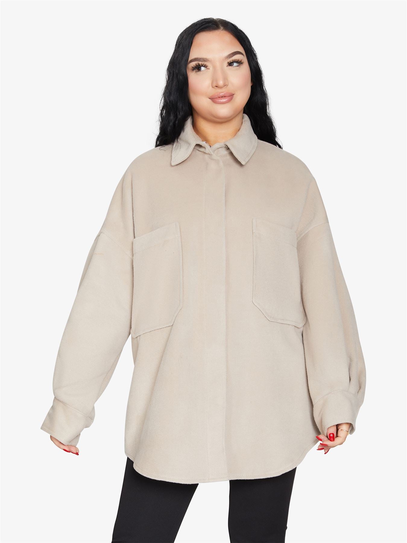 An oversized shacket featuring large patch pockets, stud button fastening, and a stylish collar, perfect for layering.