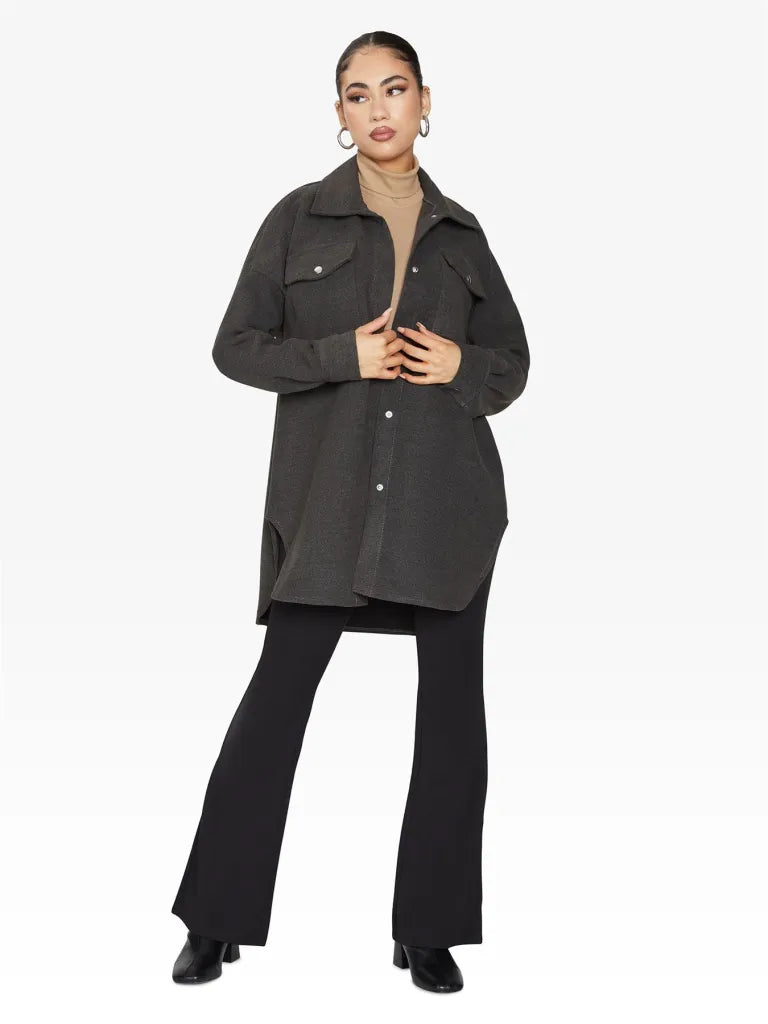 Oversized shacket with stud button fastening and front chest pockets, showcasing a stylish design.