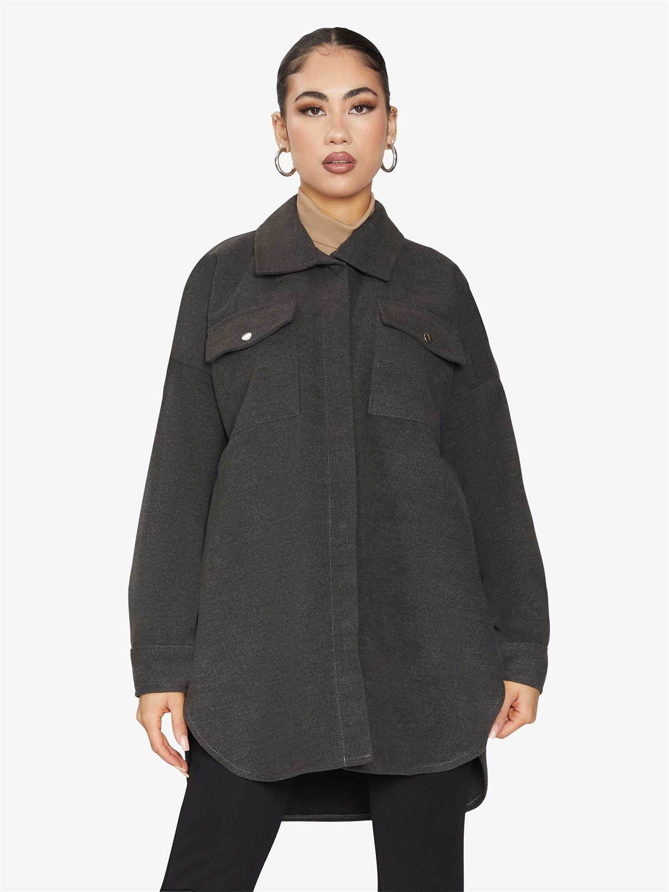 Oversized shacket with stud button fastening and front chest pockets, showcasing a stylish design.