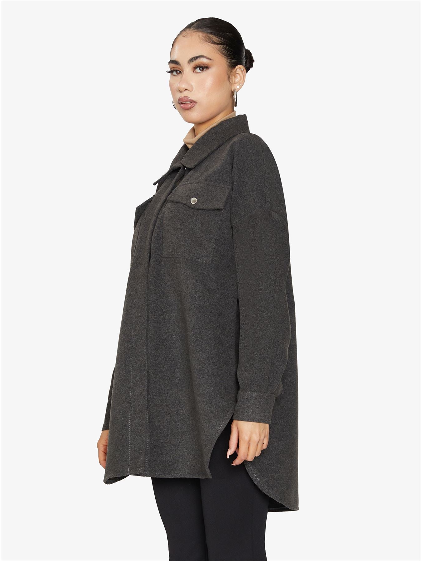 Oversized shacket with stud button fastening and front chest pockets, showcasing a stylish design.