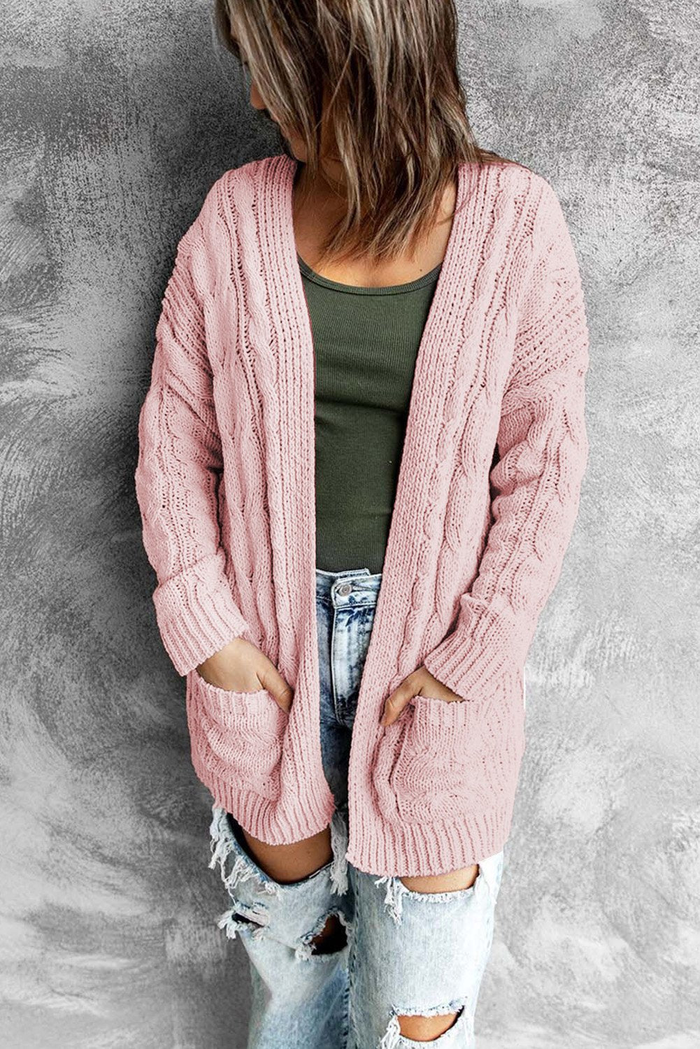 A stylish pink open front cardigan with long sleeves and pockets, perfect for winter wear.