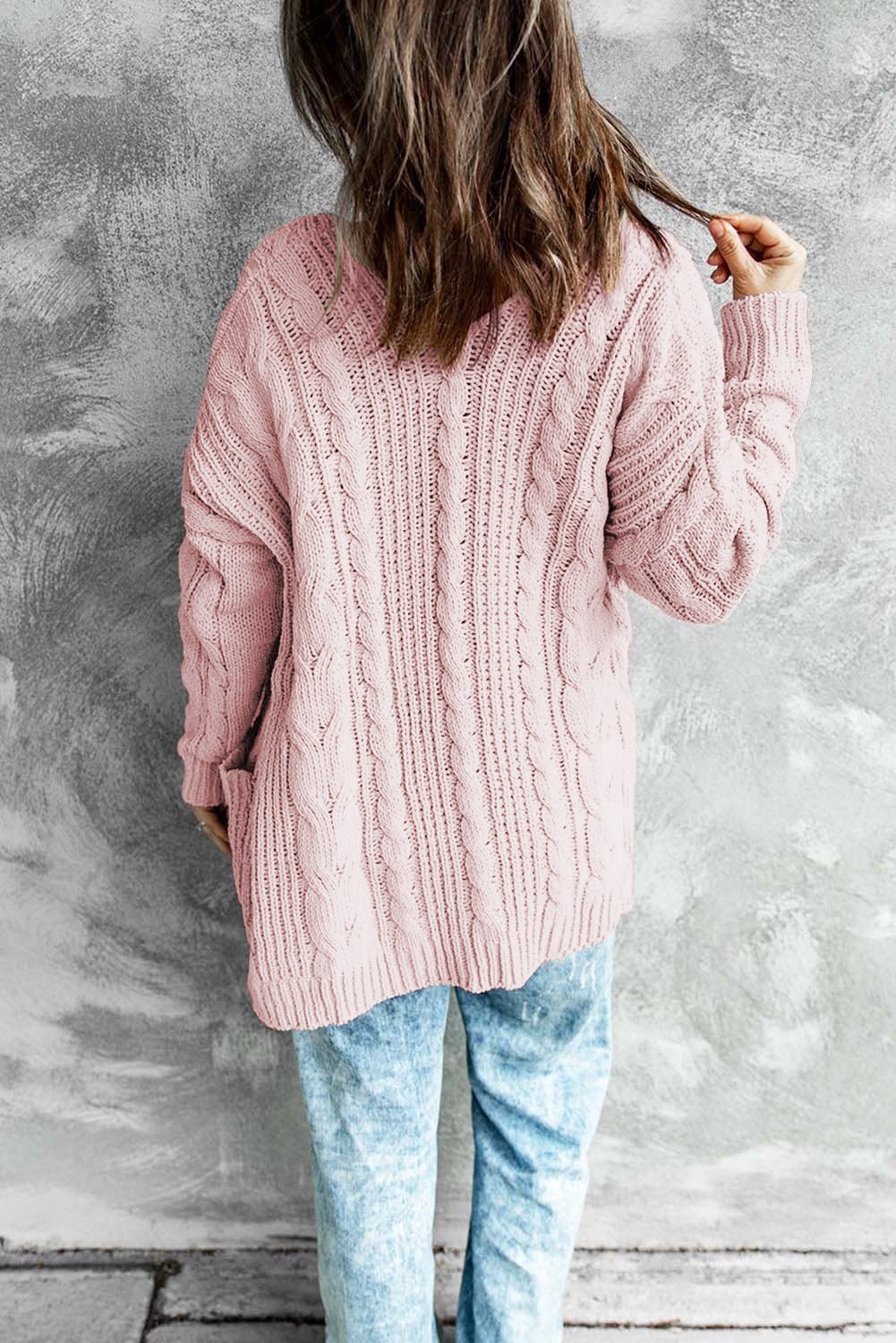 A stylish pink open front cardigan with long sleeves and pockets, perfect for winter wear.