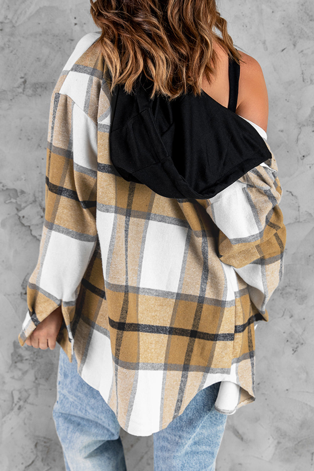 A stylish plaid hooded shirt jacket featuring long sleeves, button closure, and flap pockets, perfect for casual wear.