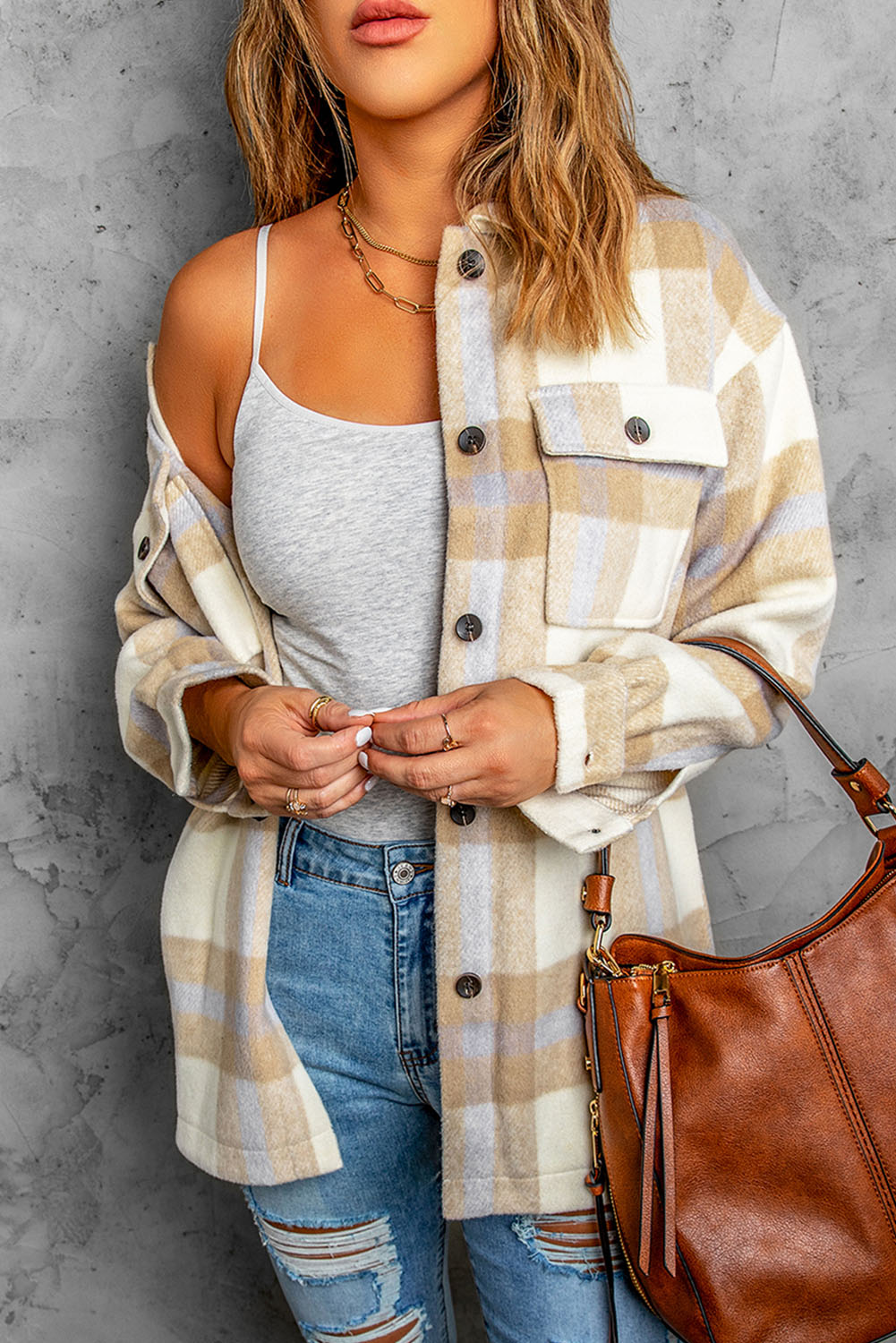 A stylish plaid print women shacket in brown and gray, featuring button closure and flap pockets, perfect for winter layering.