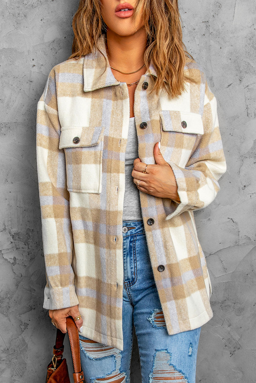 A stylish plaid print women shacket in brown and gray, featuring button closure and flap pockets, perfect for winter layering.