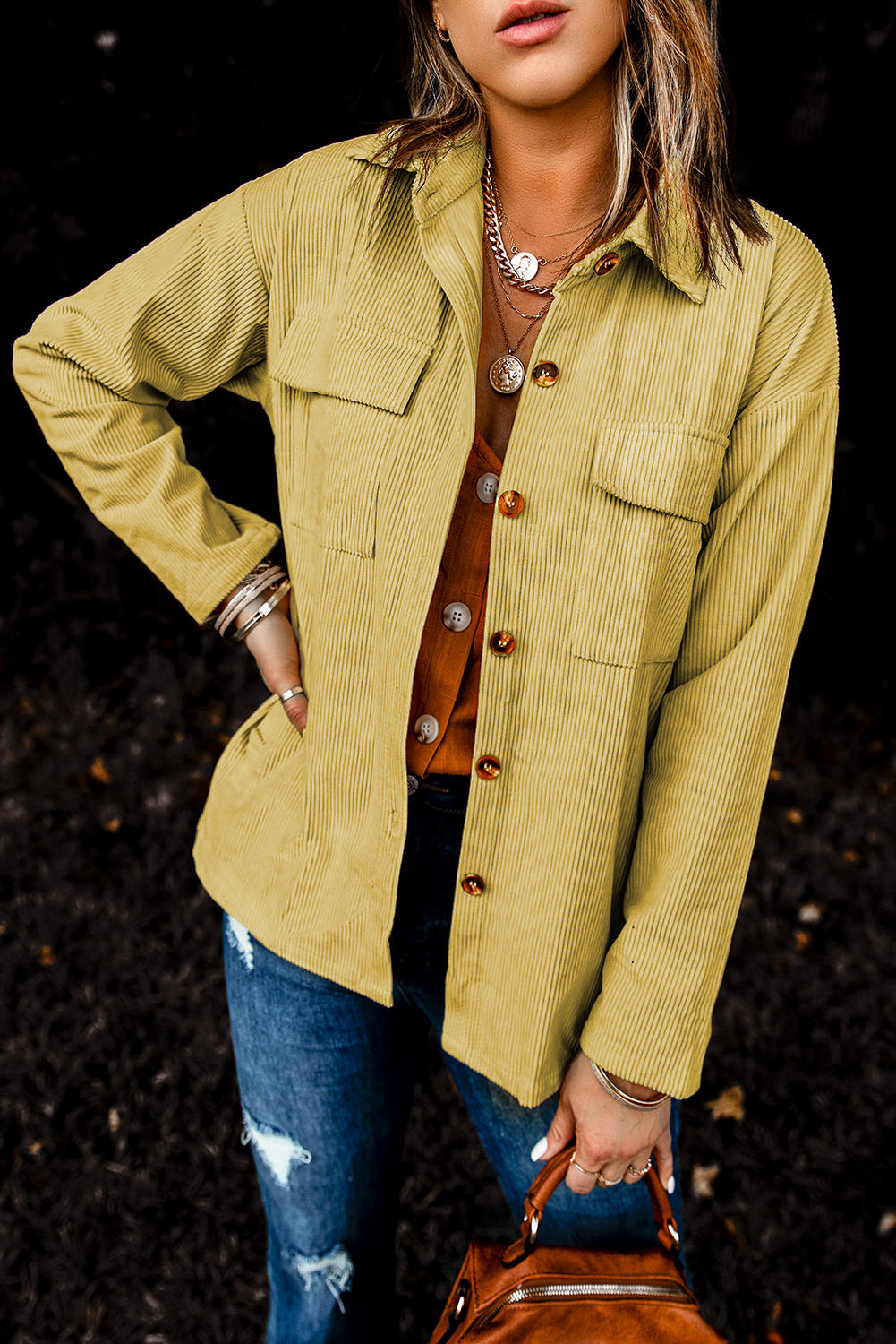 A stylish Pocketed Button Corduroy Shacket featuring a turn-down collar, button closures, and functional pockets, perfect for casual wear.