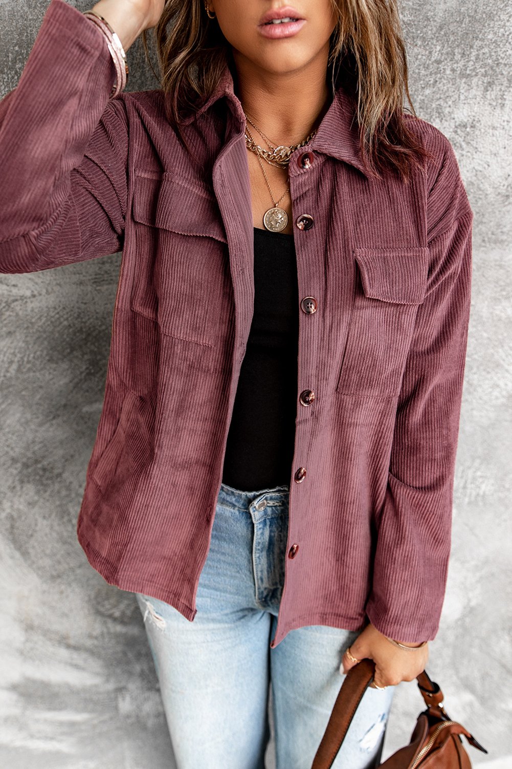 A stylish Pocketed Button Corduroy Shacket featuring a turn-down collar, button closures, and functional pockets, perfect for casual wear.