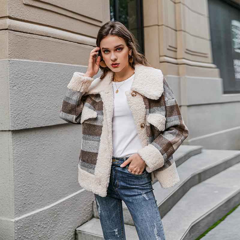 A stylish single breasted women plaid jacket coat with long sleeves, featuring a turn-down collar and pockets, perfect for autumn and winter wear.