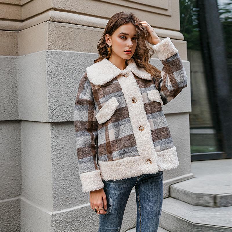 A stylish single breasted women plaid jacket coat with long sleeves, featuring a turn-down collar and pockets, perfect for autumn and winter wear.