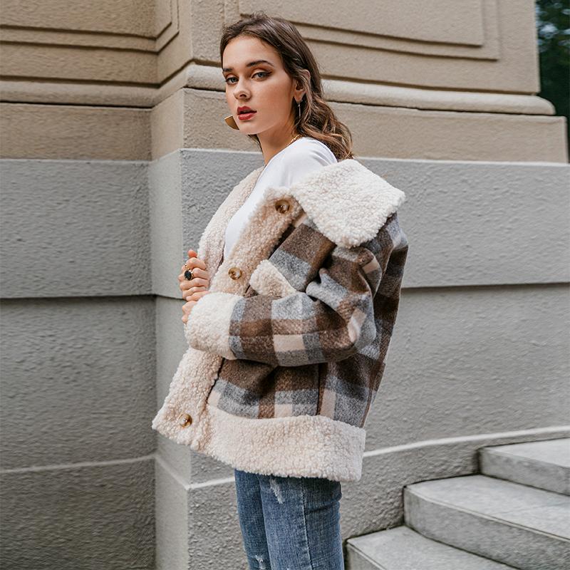 A stylish single breasted women plaid jacket coat with long sleeves, featuring a turn-down collar and pockets, perfect for autumn and winter wear.