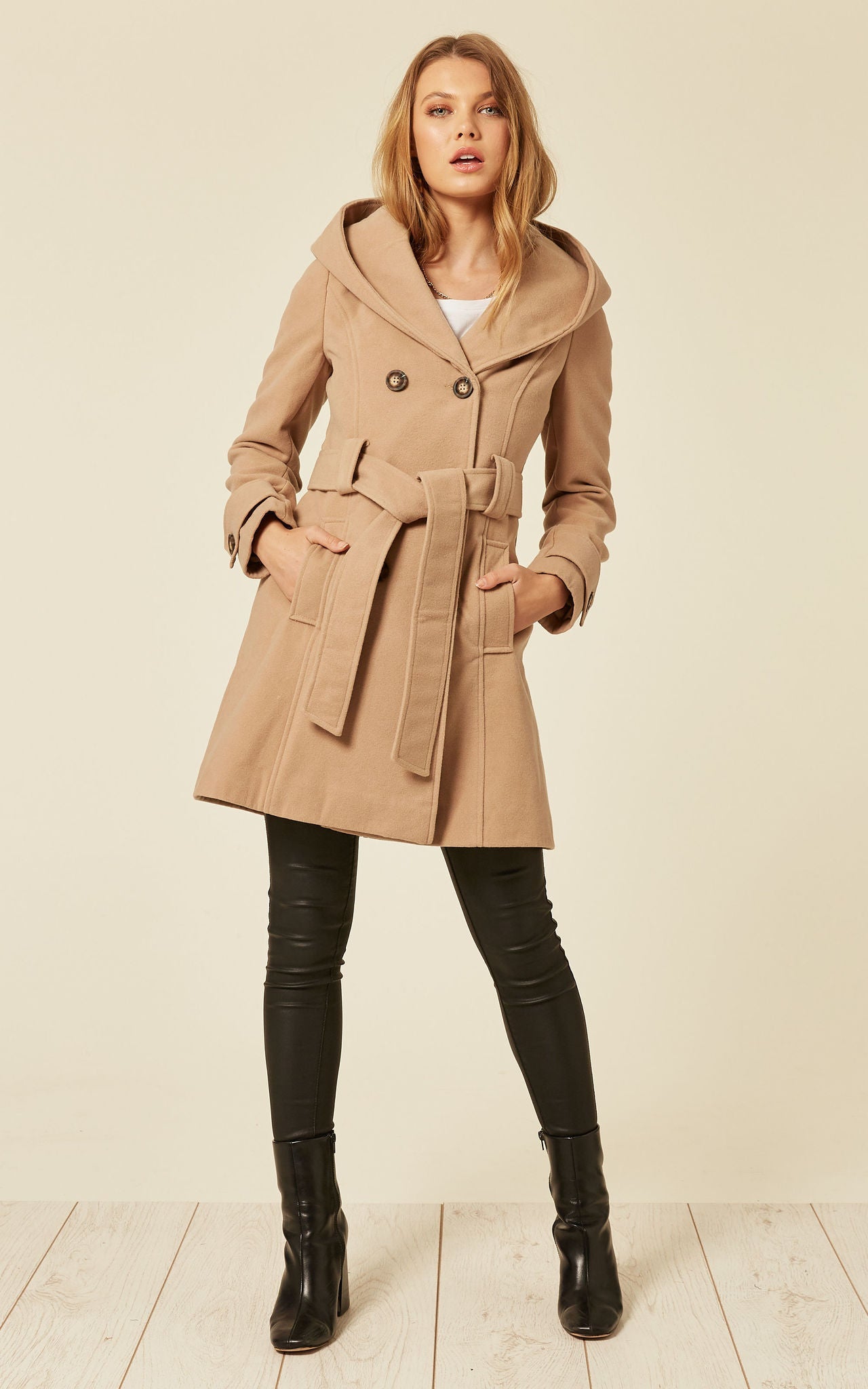 A stylish slim fit shawl hooded coat in luxurious faux wool blend, featuring a double-breasted front and a large hood.