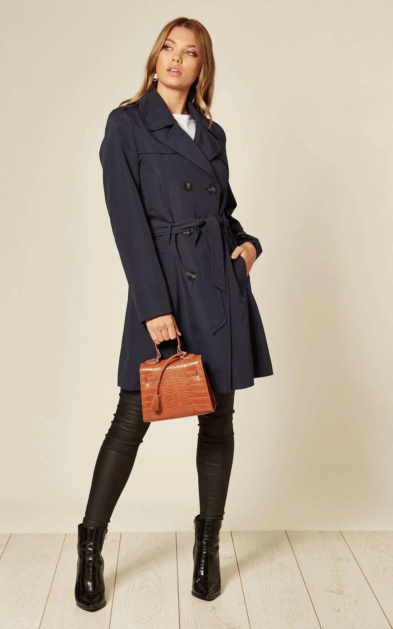 Women's Spring/Summer Military Double Breasted Trench Coat featuring epaulettes and side pockets, hip length design.