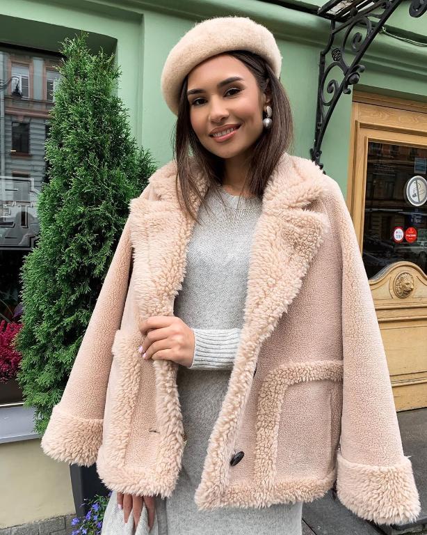 A stylish streetwear leather fur coat for women, featuring a chic faux fur design, single-breasted closure, and elegant turn-down collar, perfect for winter.