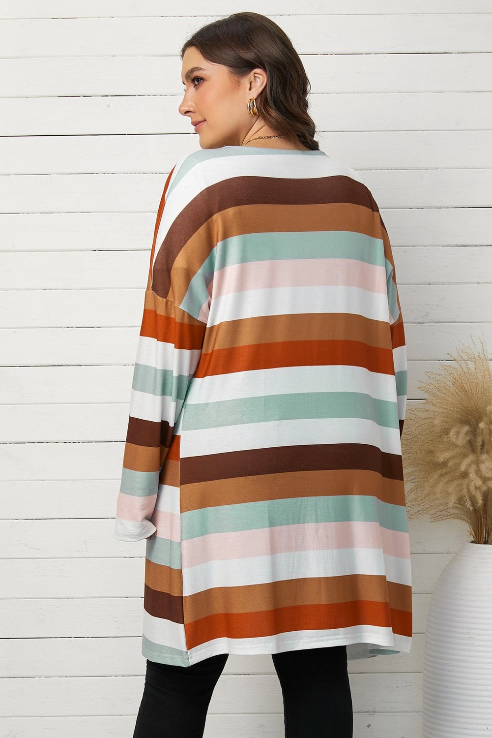 A stylish brown stripe plus size cardigan with full sleeves and pockets, perfect for layering in spring and autumn.