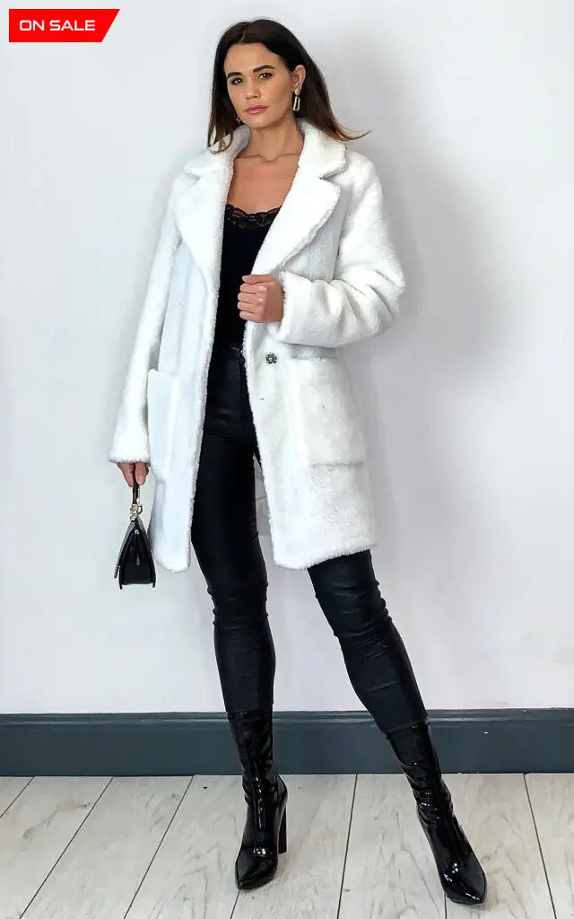 Oversized hip-length Stud Button Borg Teddy Coat with plush teddy finish, featuring popper button fastening and side pockets.