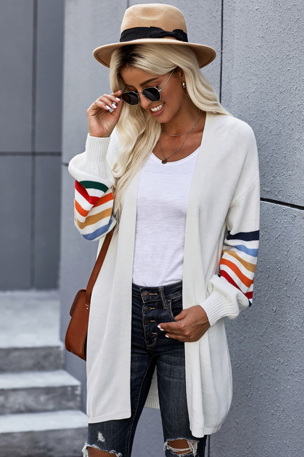 A stylish white striped balloon sleeve cardigan with an open front, featuring vibrant multi-color knit and front pockets, perfect for casual wear.