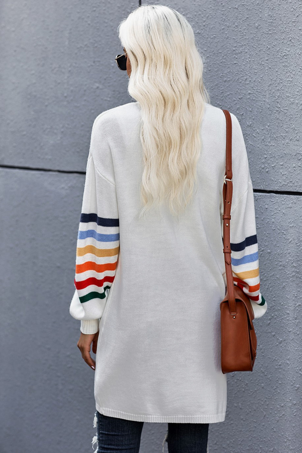 A stylish white striped balloon sleeve cardigan with an open front, featuring vibrant multi-color knit and front pockets, perfect for casual wear.