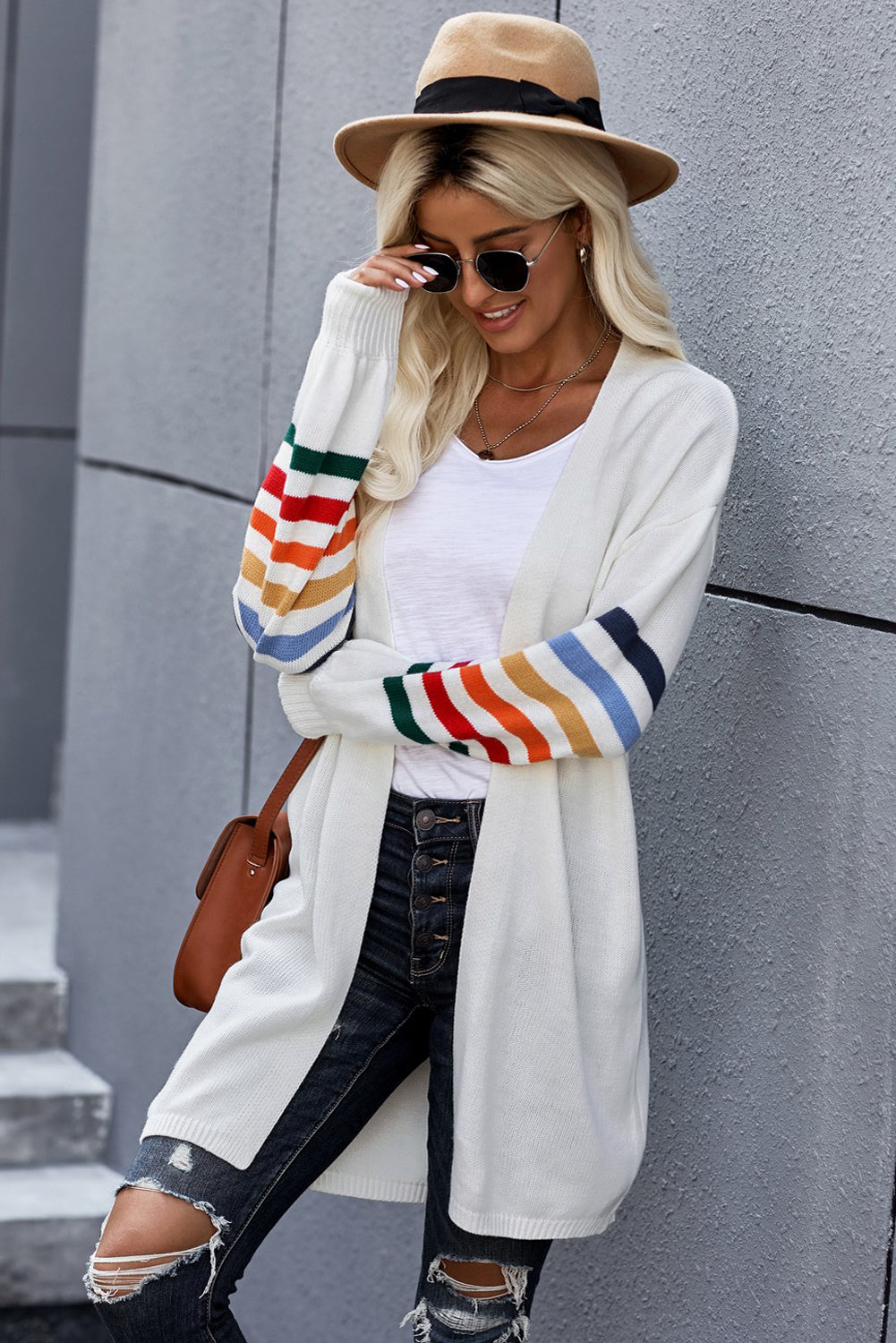 A stylish white striped balloon sleeve cardigan with an open front, featuring vibrant multi-color knit and front pockets, perfect for casual wear.