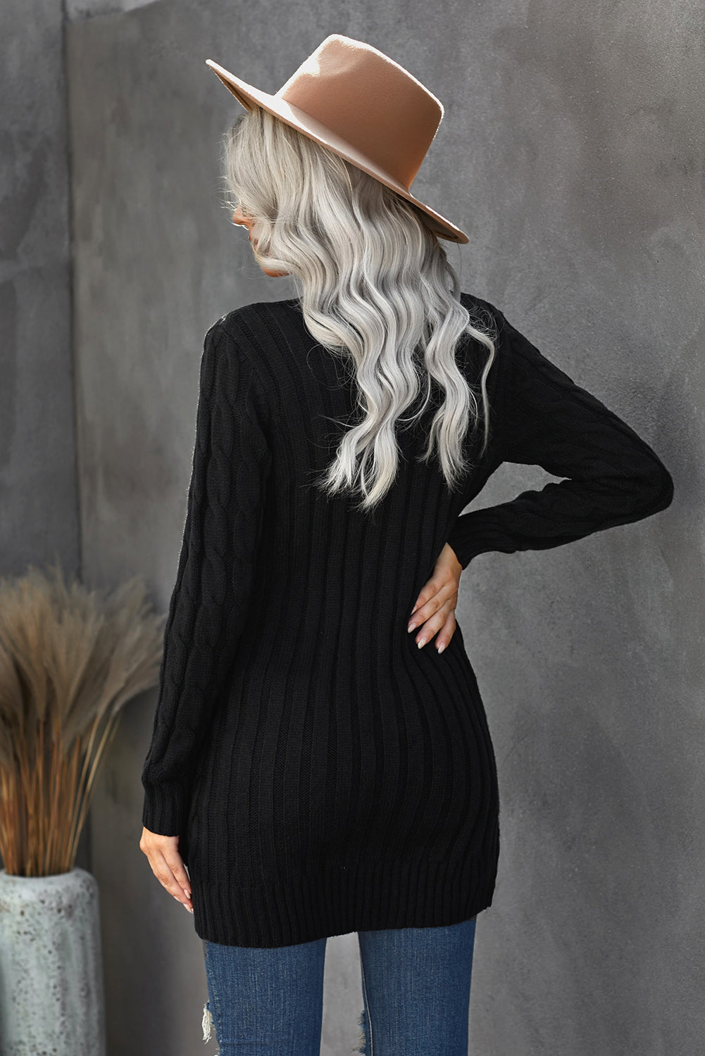 A stylish Winter Black Button Pocket Knit Cardigan featuring a chunky knit design, long sleeves, and front pockets, perfect for layering in cold weather.