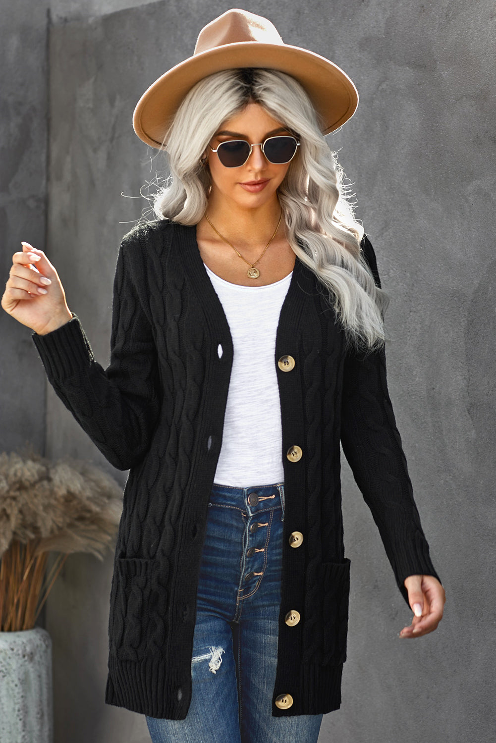 A stylish Winter Black Button Pocket Knit Cardigan featuring a chunky knit design, long sleeves, and front pockets, perfect for layering in cold weather.