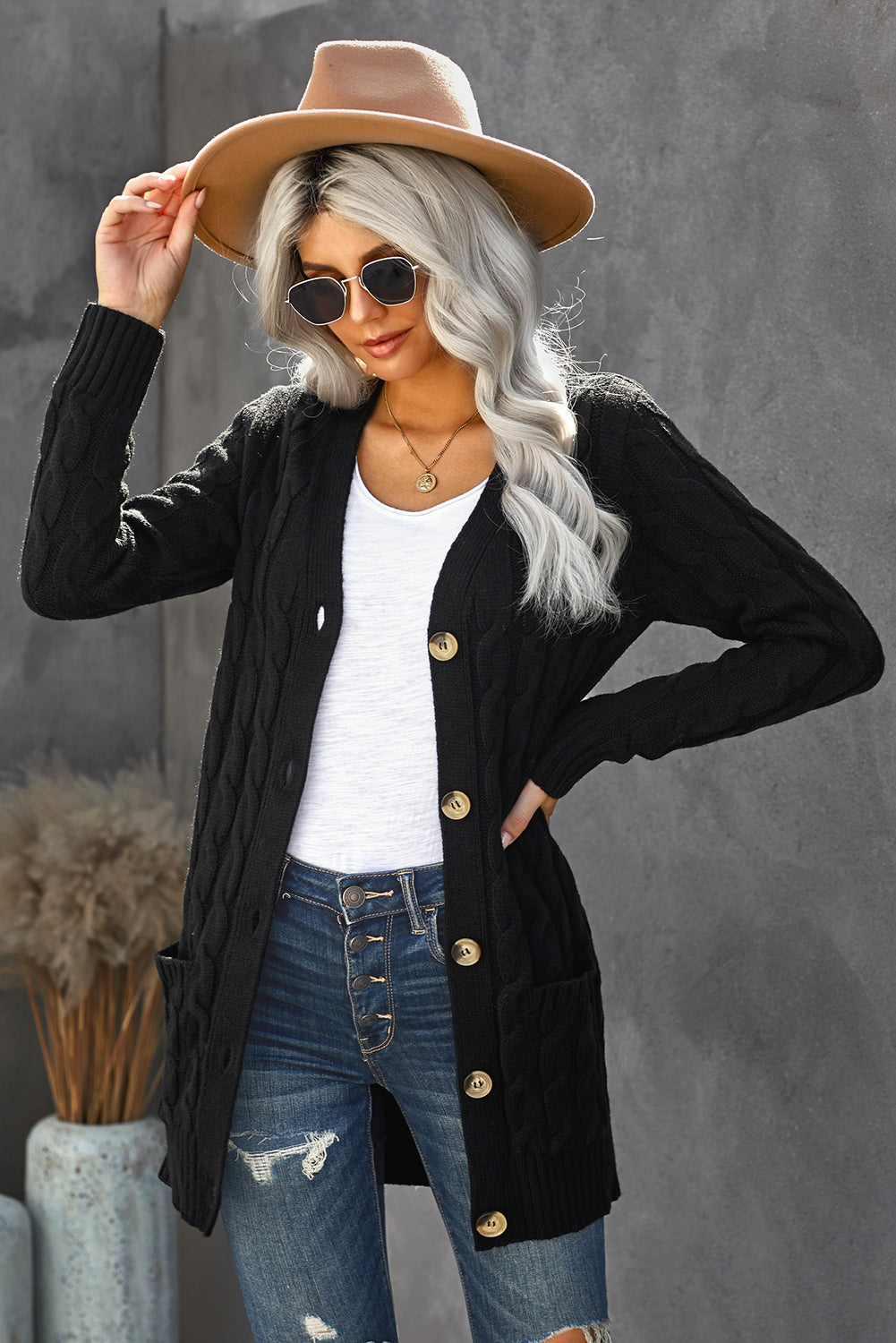 A stylish Winter Black Button Pocket Knit Cardigan featuring a chunky knit design, long sleeves, and front pockets, perfect for layering in cold weather.