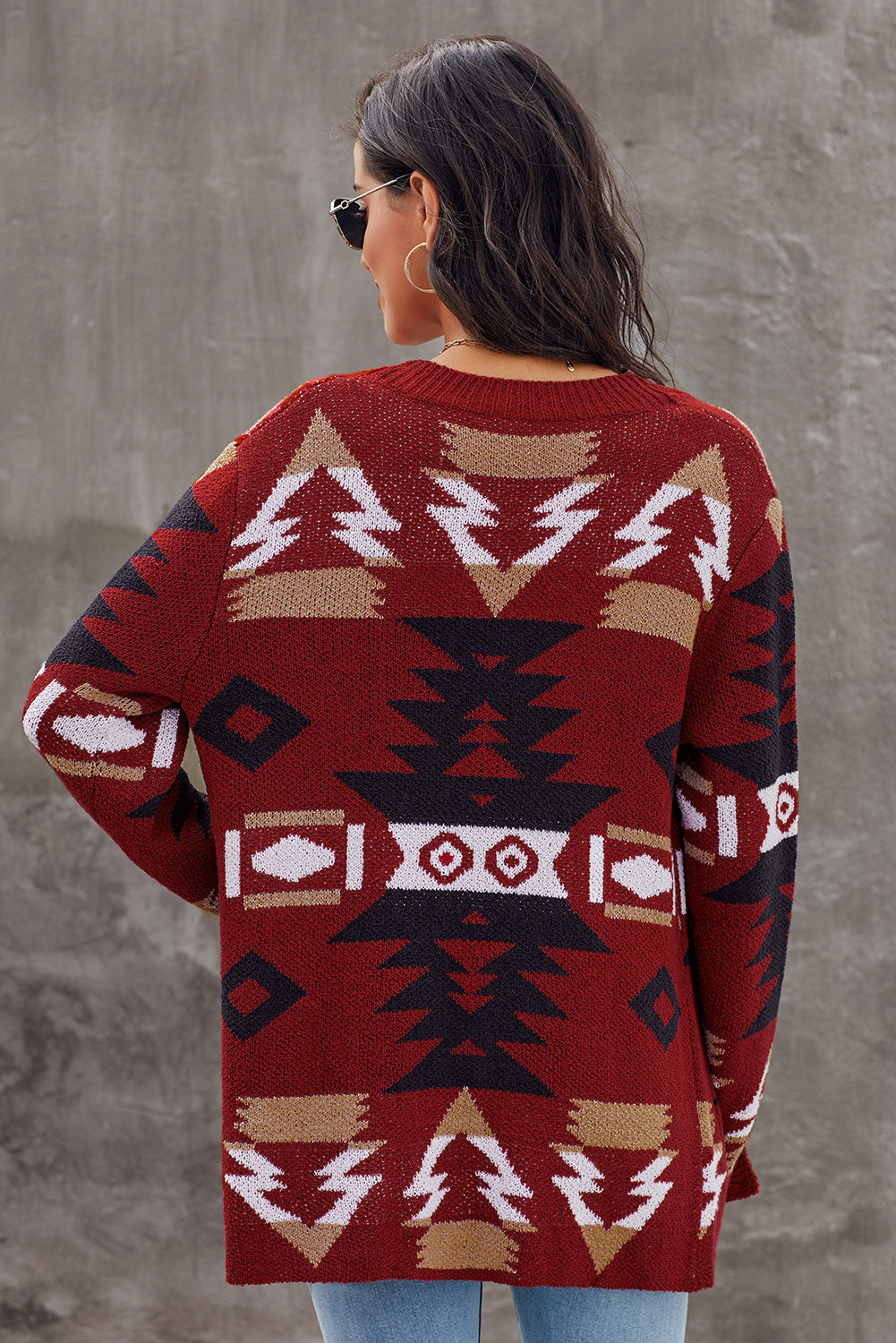 Winter Red Moraga Pocketed Aztec Cardigan featuring a vibrant red color and multicolor Aztec print, with an open front and two front pockets.