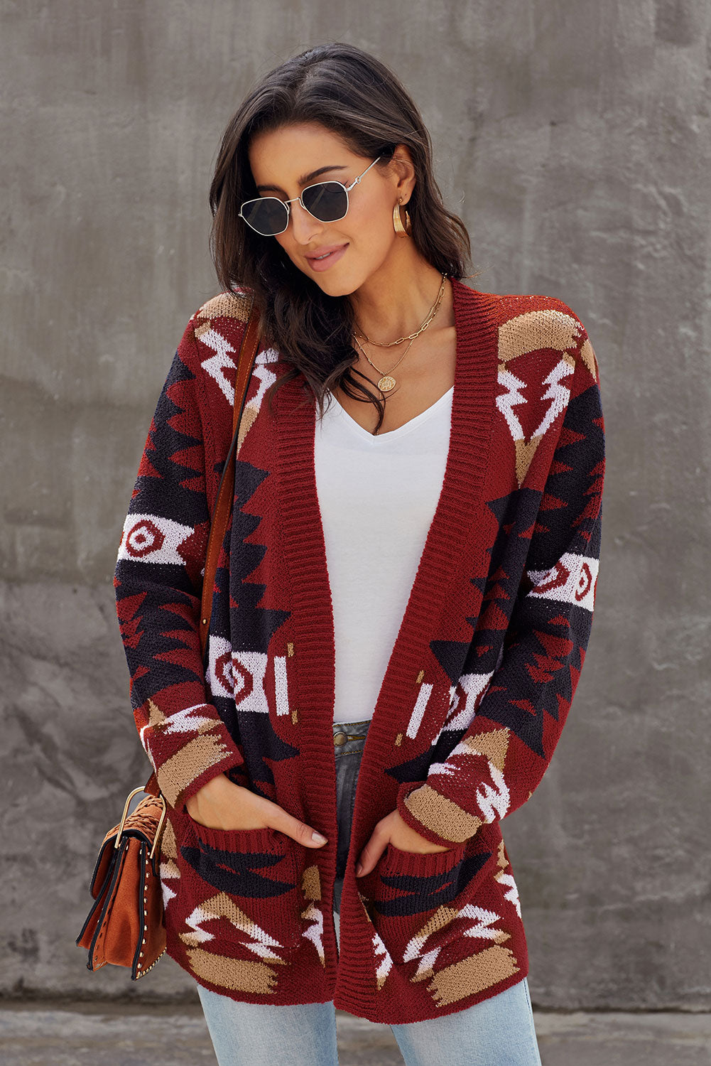 Winter Red Moraga Pocketed Aztec Cardigan featuring a vibrant red color and multicolor Aztec print, with an open front and two front pockets.