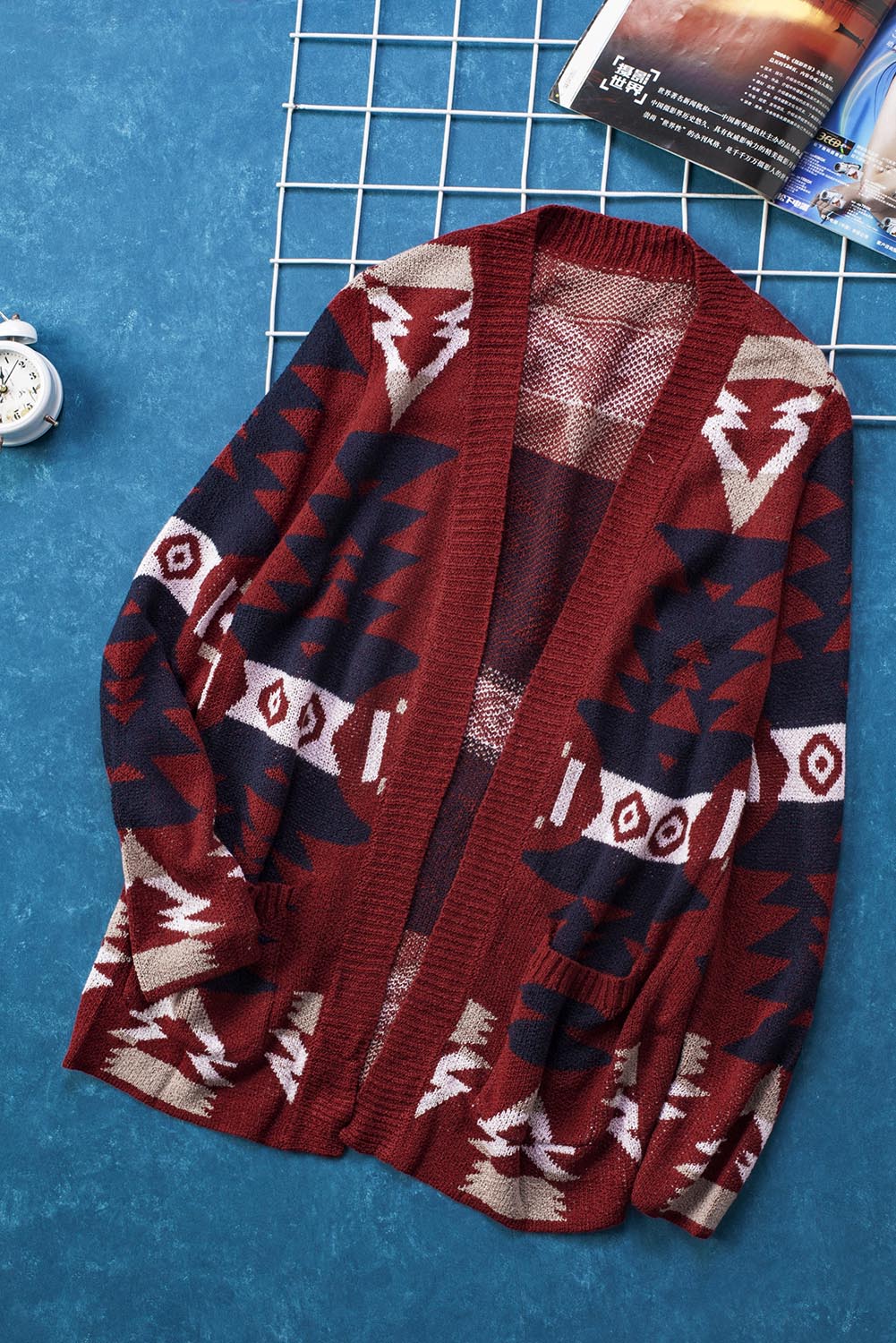 Winter Red Moraga Pocketed Aztec Cardigan featuring a vibrant red color and multicolor Aztec print, with an open front and two front pockets.